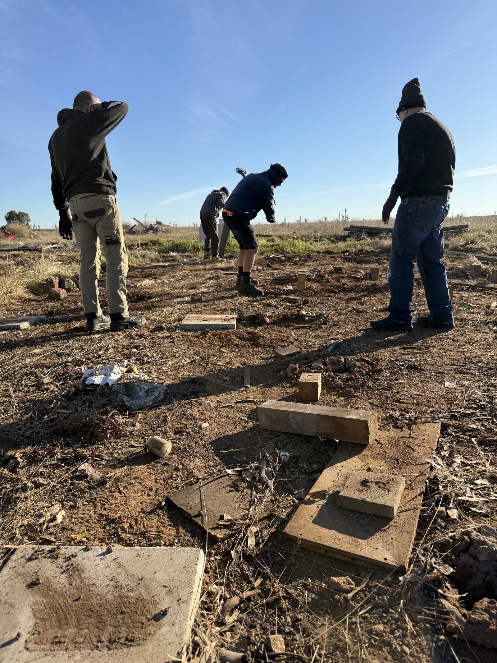 Members clearing materials from the Derrimut Grasslands site